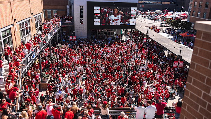 Nebraska fans pack The Railyard to watch a Husker volleyball match before the football game begins.