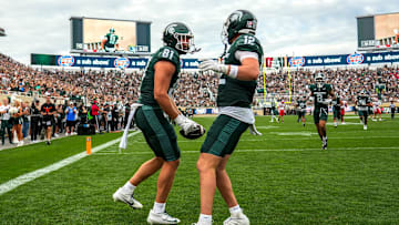 Michigan State's Michael Masunas, left, celebrates his touchdown catch with Jack Velling against Youngstown State during the third quarter on Saturday, Sept. 13, 2025, at Spartan Stadium in East Lansing.