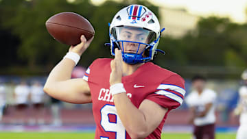 Nebraska football target Rees Wise (9) throws warmup passes before a game