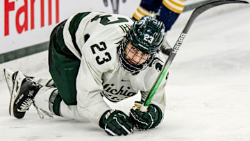 Michigan State's Shane Vansaghi gets up off the ice after falling against Notre Dame during the second period in the Big Ten tournament on Saturday, March 15, 2025, at Muni Arena in East Lansing.