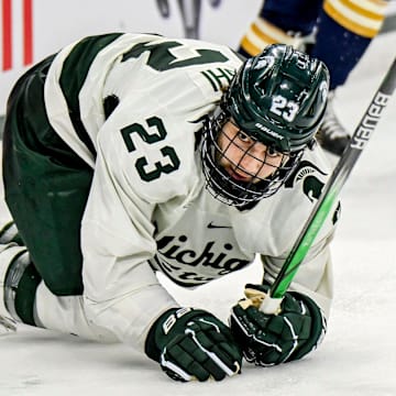 Michigan State's Shane Vansaghi gets up off the ice after falling against Notre Dame during the second period in the Big Ten tournament on Saturday, March 15, 2025, at Muni Arena in East Lansing.