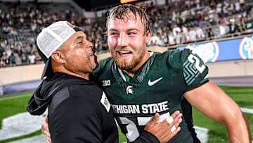 Michigan State's Cal Haladay, right, celebrates with defensive backs coach Demetrice Martin after the Spartans win over Florida Atlantic on Friday, Aug. 30, 2024, at Spartan Stadium in East Lansing.