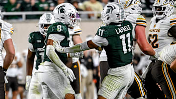 Michigan State's Aisea Moa, left, celebrates with Alessio Anelu Lafaele, right, after a tackle for a loss against Western Michigan's during the fourth quarter on Friday, Aug. 29, 2025, in East Lansing.