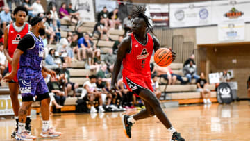 Michigan State freshman and Team Goodfellas' Kur Teng, moves the ball against Team Case Credit Union in the game on Tuesday, June 25, 2024, during the Moneyball Pro-Am at Holt High School.