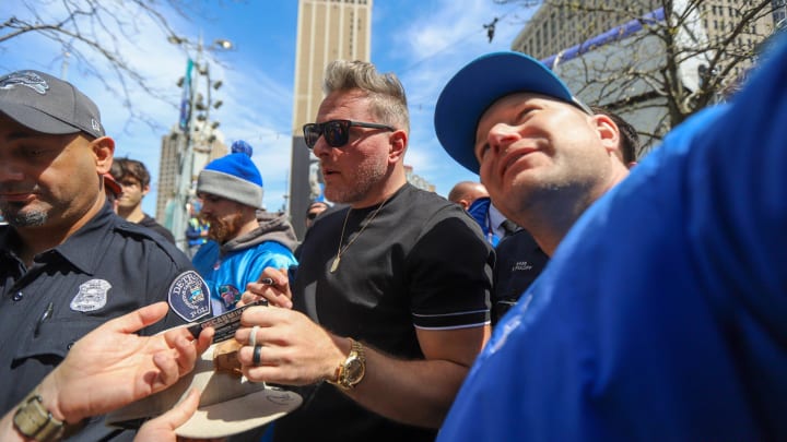 Espn personality Pat McAfee is surrounded by fans after leaving the ESPN temporary studios at the NFL Draft Experience in Downtown Detroit on Friday, April 26, 2024.