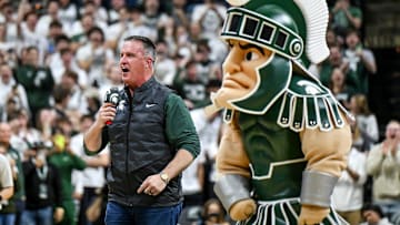 Michigan State's new football coach Pat Fitzgerald addresses the crowd during a timeout in the first half of the Spartans basketball game against Iowa on Tuesday, Dec. 2, 2025, at the Breslin Center in East Lansing.