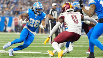 Detroit Lions running back Jahmyr Gibbs (26) runs the ball in the first quarter against the Washington Commanders in the NFC divisional round at Ford Field in Detroit on Saturday, Jan. 18, 2025.