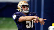 Notre Dame junior long snapper Rino Monteforte works through a drill at football practice Wednesday, March 27, 2024, at the Irish Athletics Center in South Bend.