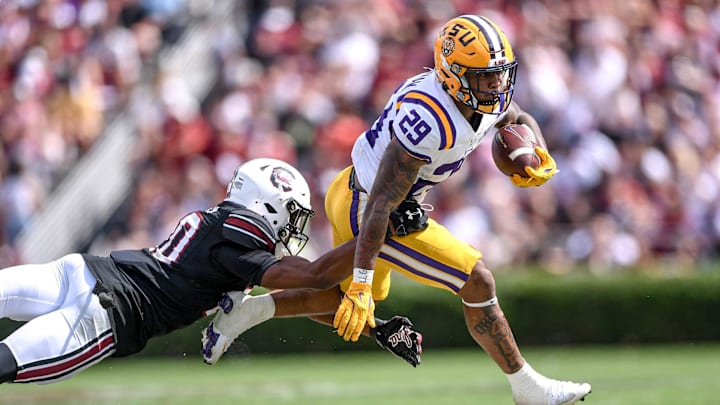 Louisiana State University running back Caden Durham (29) runs near South Carolina defensive back Judge Collier (20) during the fourth quarter at Williams-Brice Stadium in Columbia, S.C. Saturday, September 14, 2024.