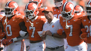 Sep 21, 2024; Clemson, South Carolina, USA; Clemson Tigers head coach Dabo Swinney with running back Phil Mafah (7) and safety Khalil Barnes (7) before a game against the North Carolina State Wolfpack at Memorial Stadium. Mandatory Credit: Ken Ruinard-Imagn Images