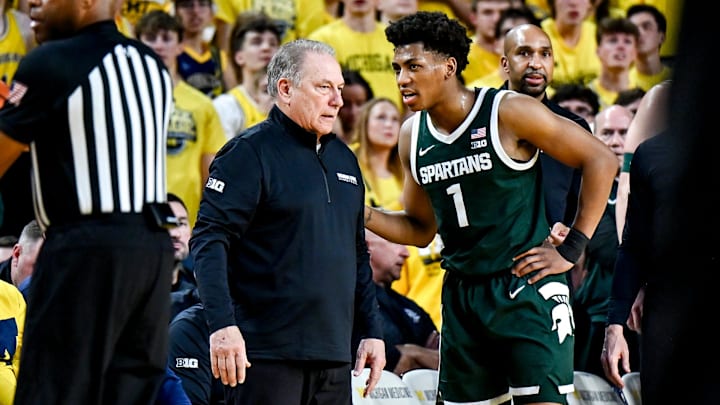 Michigan State's head coach Tom Izzo, left, talks with Jeremy Fears Jr. during the first half in the game against Michigan on Sunday, March 8, 2026, at the Crisler Center in Ann Arbor.