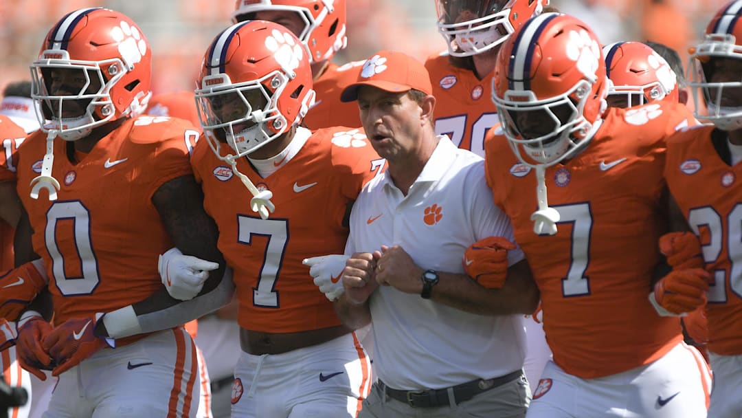Sep 21, 2024; Clemson, South Carolina, USA; Clemson Tigers head coach Dabo Swinney with running back Phil Mafah (7) and safety Khalil Barnes (7) before a game against the North Carolina State Wolfpack at Memorial Stadium. Mandatory Credit: Ken Ruinard-Imagn Images
