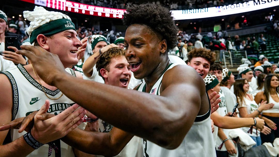 Michigan State's Cam Ward celebrates with fans after the Spartans victory over Arkansas on Saturday, Nov. 8, 2025, at the Breslin Center in East Lansing.