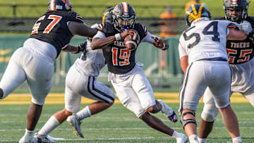 Belleville QB Bryce Underwood runs for yards against Clarkston during the 2024 Xenith Prep Kickoff Classic at Wayne State's Tom Adams Field in Detroit on Friday, Aug. 30, 2024.