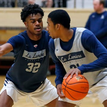 La Lumiere junior Jalen Haralson (32) defends teammate Ace Bucker during an open practice Thursday, Nov. 9, 2023, at the La Porte Civic Auditorium.