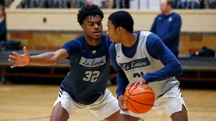 La Lumiere junior Jalen Haralson (32) defends teammate Ace Bucker during an open practice Thursday, Nov. 9, 2023, at the La Porte Civic Auditorium.