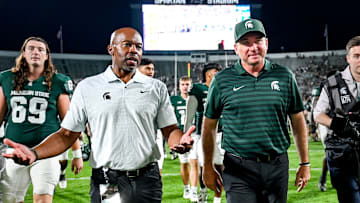 Michigan State football coach Jonathan Smith, right, talks with athletic director Alan Haller after MSU's victory over Florida Atlantic on Friday, Aug. 30, 2024, at Spartan Stadium in East Lansing.