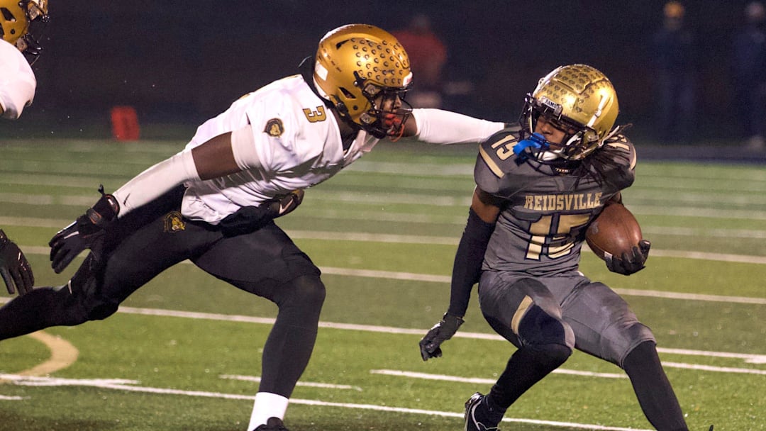Reidsville's Dionte Neal tries to elude a Shelby defender in the 2023 North Carolina 2-A Western Region championship game.