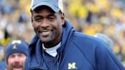 Former Michigan basketball player Chris Webber walks on the football field Michigan Vs Penn State