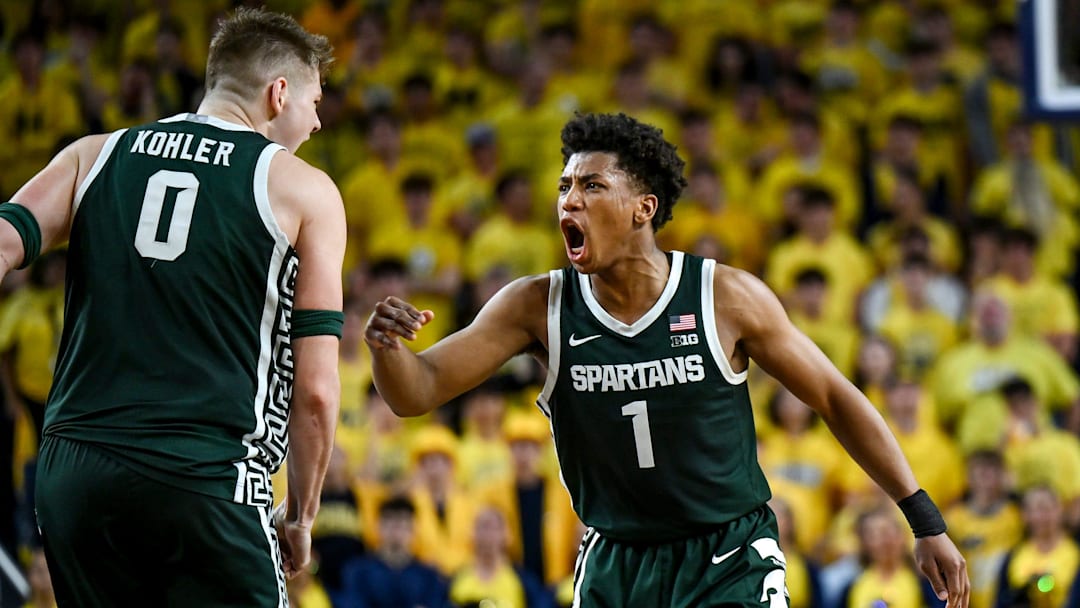 Michigan State's Jeremy Fears Jr., left, celebrates with Jaxon Kohler after Kohler's 3-pointer against Michigan during the first half on Sunday, March 8, 2026, at the Crisler Center in Ann Arbor.