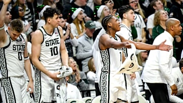 Michigan State's Jeremy Fears Jr., right, and the Spartans bench celebrate Jase Richardson's 3-pointer against Nebraska during the second half on Saturday, Dec. 7, 2024, at the Breslin Center in East Lansing.