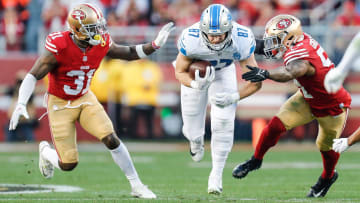 Lions tight end Sam LaPorta runs against 49ers safety Tashaun Gipson Sr., left, during the first half of the NFC championship game.