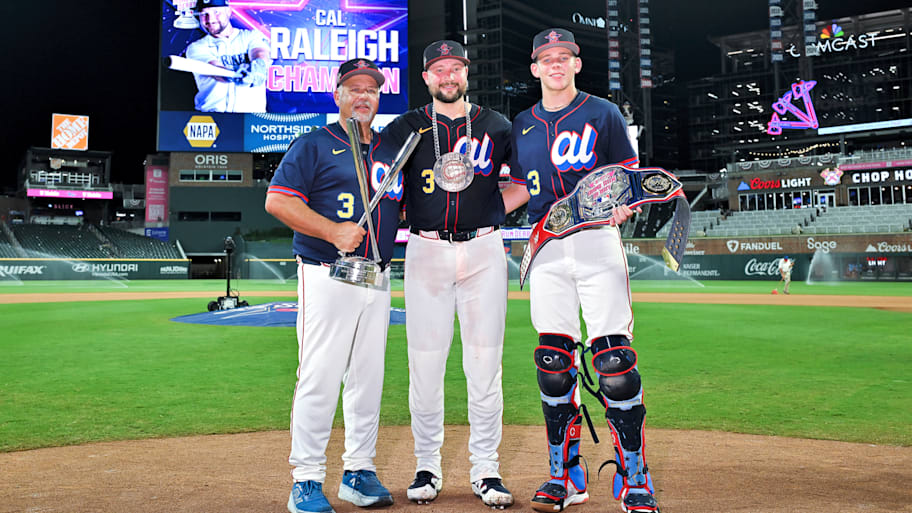 Cal Raleigh and his family members pose with 2025 Home Run Derby trophy