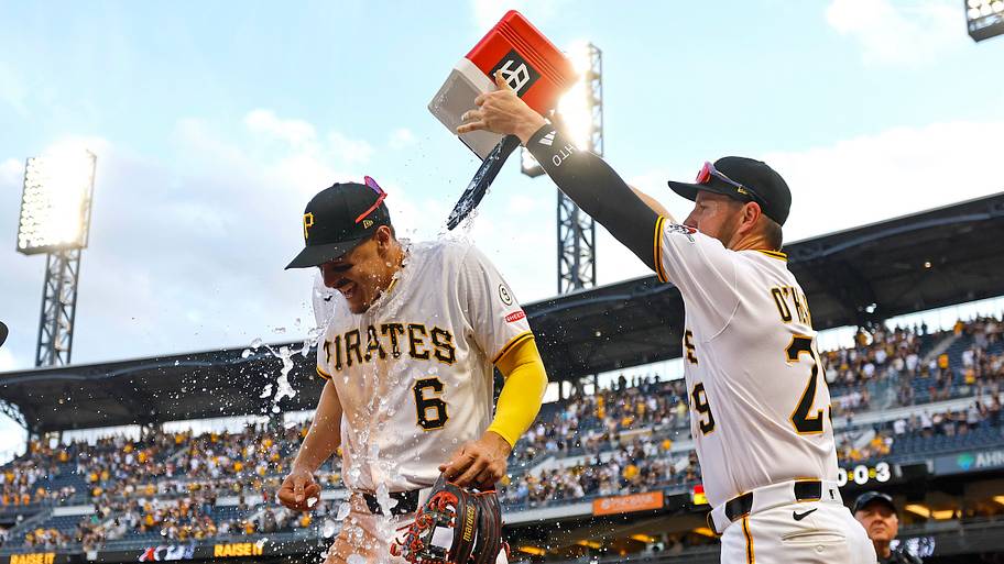 Pirates first baseman Ryan O'Hearn, right, dumps a cooler on teammate Konnor Griffin.