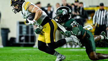 Michigan State's Darius Snow, right, tackles Iowa's Kaden Wetjen in the first quarter on Saturday, Oct. 19, 2024, at Spartan Stadium in East Lansing.