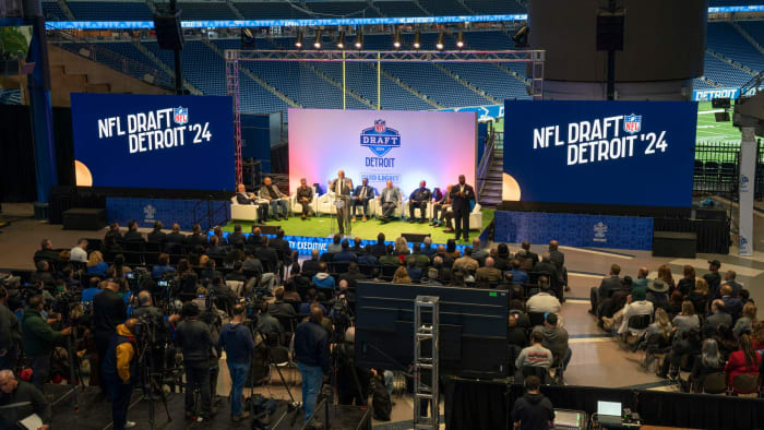 Wayne County Executive Warren C. Evans takes the stage during a news conference at Ford Field on