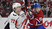 Apr 25, 2025; Montreal, Quebec, CAN; Washington Capitals forward Anthony Beauvillier (72) and Montreal Canadiens defenseman Lane Hutson (48) battle in front of the net during the first period in game three of the first round of the 2025 Stanley Cup Playoffs at the Bell Centre. Mandatory Credit: Eric Bolte-Imagn Images
