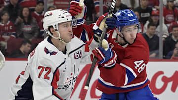 Apr 25, 2025; Montreal, Quebec, CAN; Washington Capitals forward Anthony Beauvillier (72) and Montreal Canadiens defenseman Lane Hutson (48) battle in front of the net during the first period in game three of the first round of the 2025 Stanley Cup Playoffs at the Bell Centre. Mandatory Credit: Eric Bolte-Imagn Images