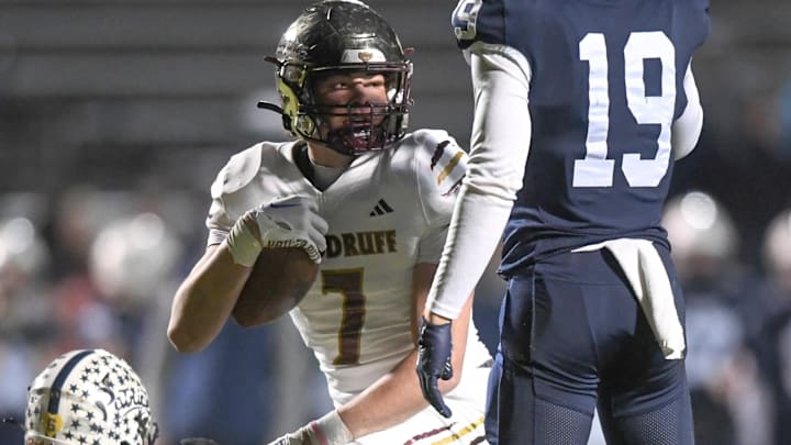 Woodruff High junior Kam Taylor (7) gets up after a catch near Powdersville High senior Jacob Matocha (19) during the first quarter of State Class 3A football playoffs at Powdersville High School in Greenville, S.C. Friday, November 22, 2024.