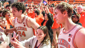 Jan 14, 2023; Clemson, South Carolina, USA; Clemson sophomore forward PJ Hall (24) and Clemson forward Hunter Tyson (5) celebrate with fans after the Tigers beat Duke 72-64 at Littlejohn Coliseum.