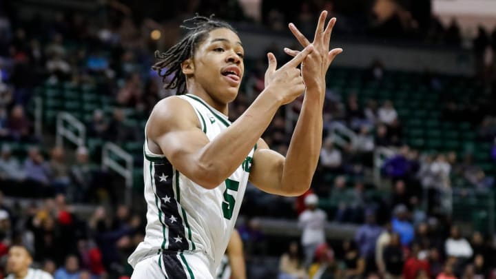 Cass Tech guard Darius Acuff (5) celebrates a play against Muskegon during the second half of the MHSAA boys Division 1 final at Breslin Center in East Lansing on Saturday, March 25, 2023.