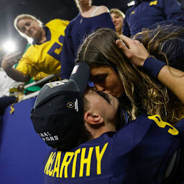 McCarthy kisses his fiance Katya Kuropas.