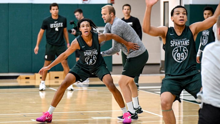 Michigan State's Jordan Scott, left, and Divine Ugochukwu participate in a drill during the first day of basketball practice on Monday, Sept. 22, 2025, at the Breslin Center in East Lansing.