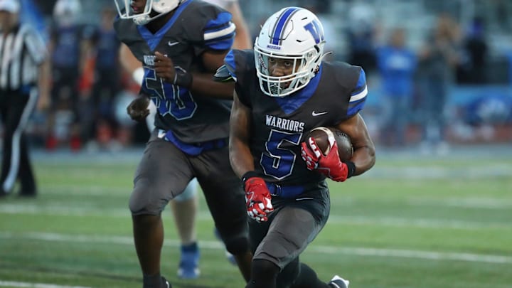 Walled Lake Western running back Donovan Triplett scores against White Lake Lakeland during first-half action at Walled Lake Western High School on Friday, Sept. 22, 2023.