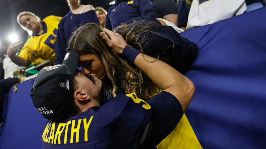 McCarthy kisses his fiance Katya Kuropas. | Junfu Han / USA TODAY NETWORK