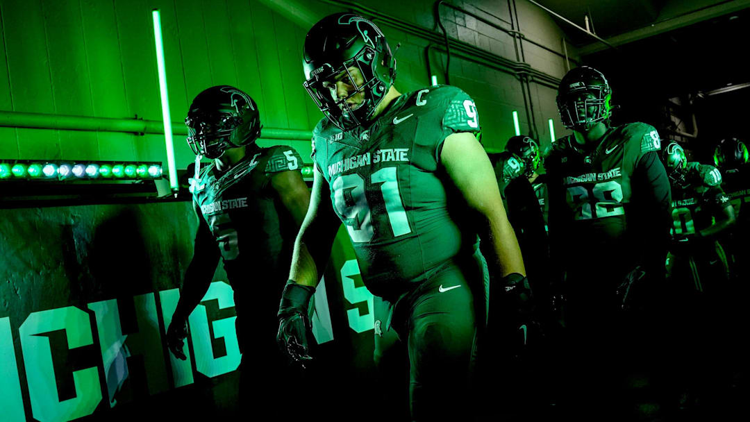 Michigan State's Alex VanSumeren, right, and Jordan Hall, left, walk to the field before the game against Michigan on Saturday, Oct. 25, 2025, at Spartan Stadium in East Lansing.