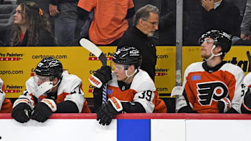 Jan 30, 2025; Philadelphia, Pennsylvania, USA; Philadelphia Flyers head coach John Tortorella walks behind right wing Matvei Michkov (39) in the final seconds of loss to the New York Islanders during the third period at Wells Fargo Center.