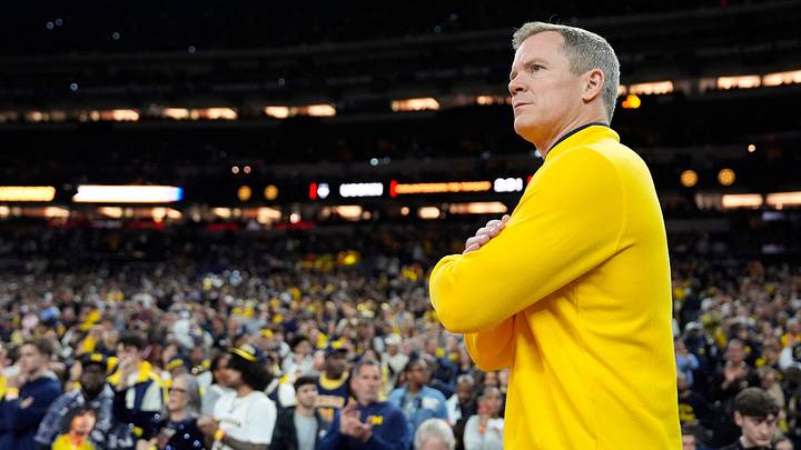 Michigan head coach Dusty May looks on from the court ahead of the NCAA national championship game against Connecticut at Lucas Oil Stadium in Indianapolis on Monday, April 6, 2026.