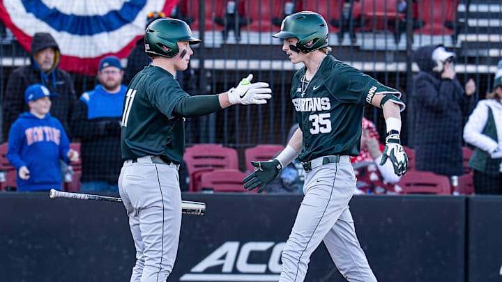 Michigan State infielder Randy Seymour (35) crosses home plate after his eighth-inning home run gave the Spartans a 4–3 lead at Jim Patterson Stadium as Michigan State defeated the Louisville Cardinals in the season opener in Louisville, Ky., on Friday, Feb. 13, 2026.