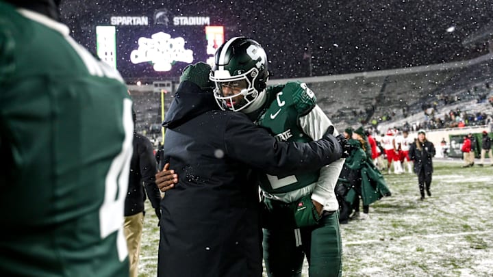 Michigan State's Aidan Chiles hugs a staff member while leaving the field after the Spartans loss to Rutgers on Saturday, Nov. 30, 2024, at Spartan Stadium in East Lansing.
