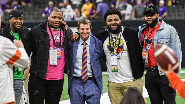 Former Clemson players, from left; Clelin Ferrel, Dexter Lawrence, Christian Wilkins, and Austin Bryant pose with head coach Dabo Swinney before of the College Football Playoff National Championship game in New Orleans Monday, January 13, 2020.

Pregame Fans Clemson Lsu Football Cfp National Championship New Orleans