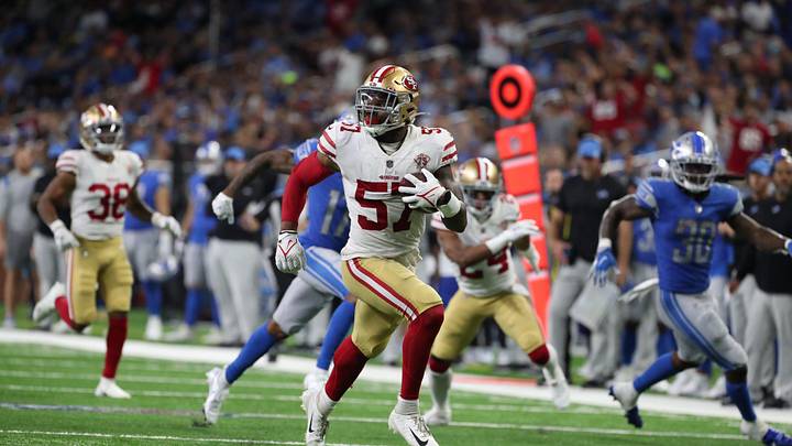 San Francisco 49ers linebacker Dre Greenlaw returns an interception back for a touchdown against the Detroit Lions on Sunday, Sept. 12, 2021 at Ford Field.