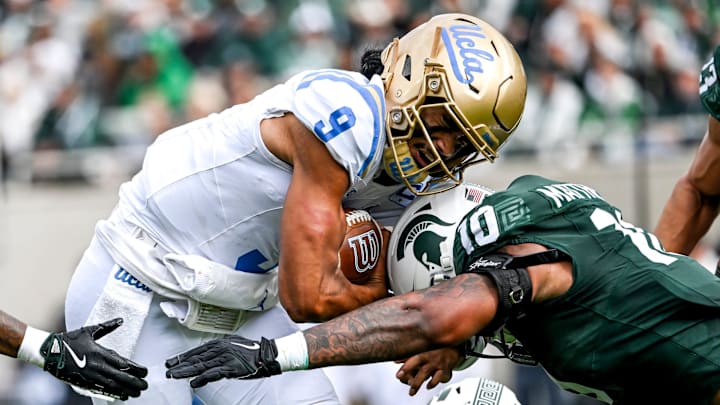 Michigan State's Wayne Matthews III, right, tackles UCLA's Nico Iamaleava during the second quarter on Saturday, Oct. 11, 2025, at Spartan Stadium in East Lansing.