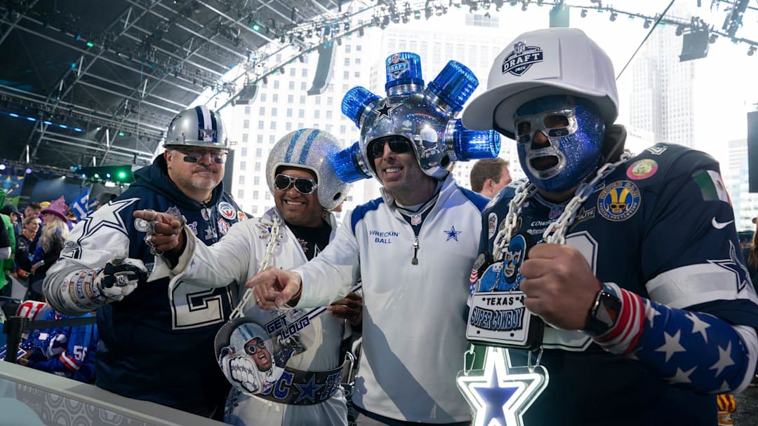 Dallas Cowboys fans pose in the main theater on Thursday, April 25, 2024 for the first day of the NFL Draft in Detroit.