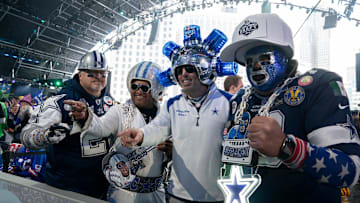 Dallas Cowboys fans pose in the main theater on Thursday, April 25, 2024 for the first day of the NFL Draft in Detroit.