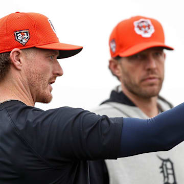 Detroit Tigers pitching coach Chris Fetter talks to pitcher Shelby Miller during spring training.